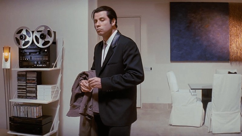Confused John Travolta looking around